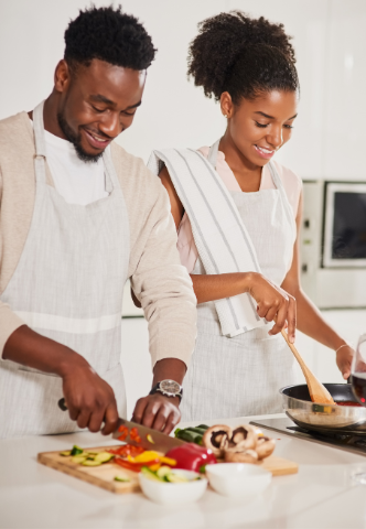 Couple cooking a fertility friendly meal together.